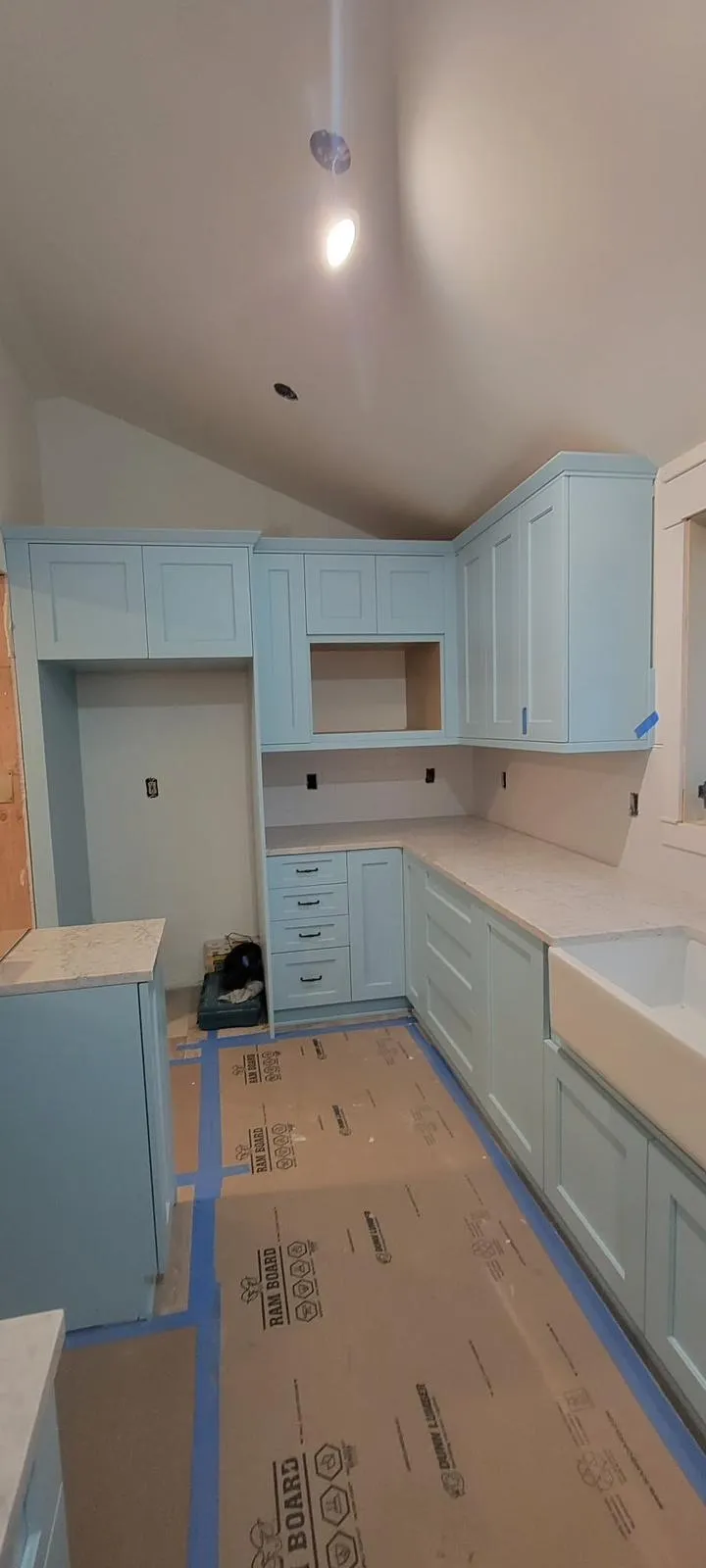 Kitchen remodel by All Custom Building — custom blue shaker cabinets