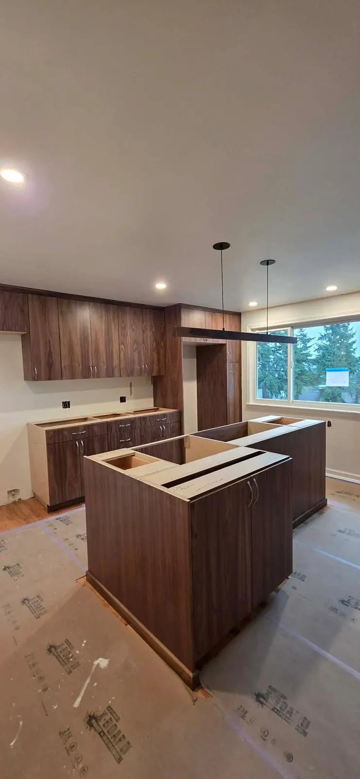 Walnut kitchen with island by All Custom Building