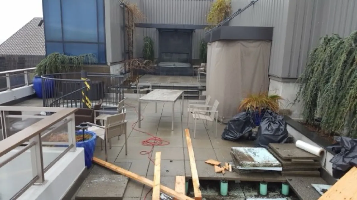 Rooftop patio by All Custom Building — outdoor living with fireplace